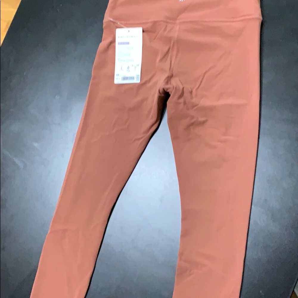 7/8 Elation Rust Athleta tight NWT